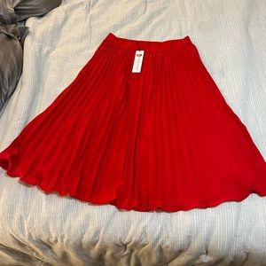 Red pleated skirt